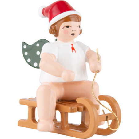 Weihnachtsengel mit Mütze auf Schlitten sitzend - 6,5 cm